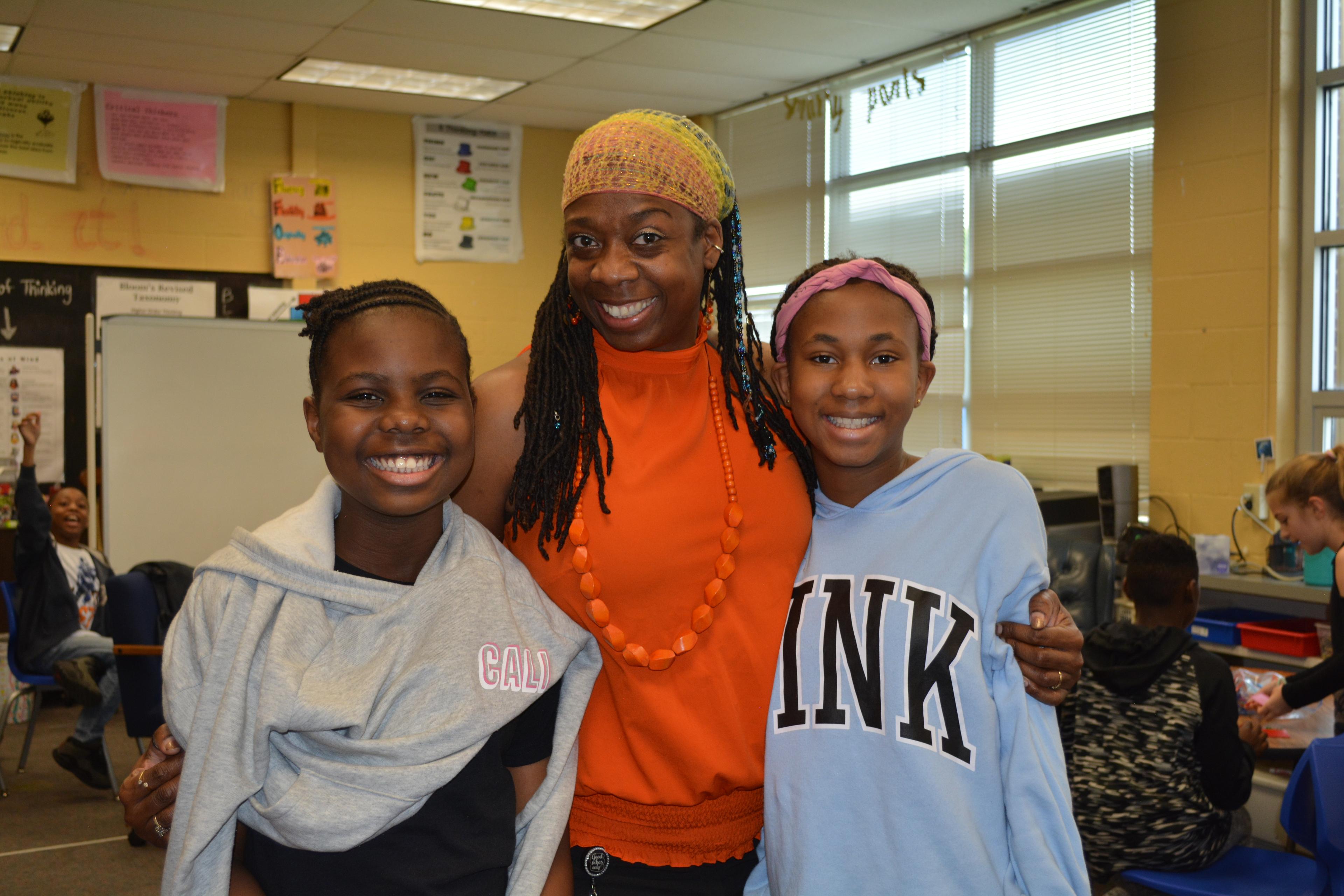 Ta-Tanisha and two students smiling